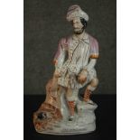 A 19th century Staffordshire pottery figure 'The Lion Slayer', painted, on an ovoid base. H.39.5cm.