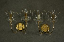 A pair of contemporary gilt brass and Spectra Swarovski crystal two branch wall lights designed by