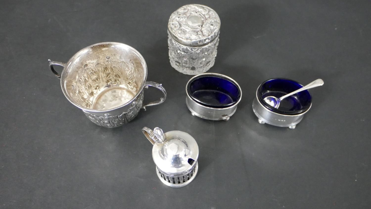 A collection of silver, including a repousse Art Nouveau design twin handled cup, a silver mustard - Image 3 of 12