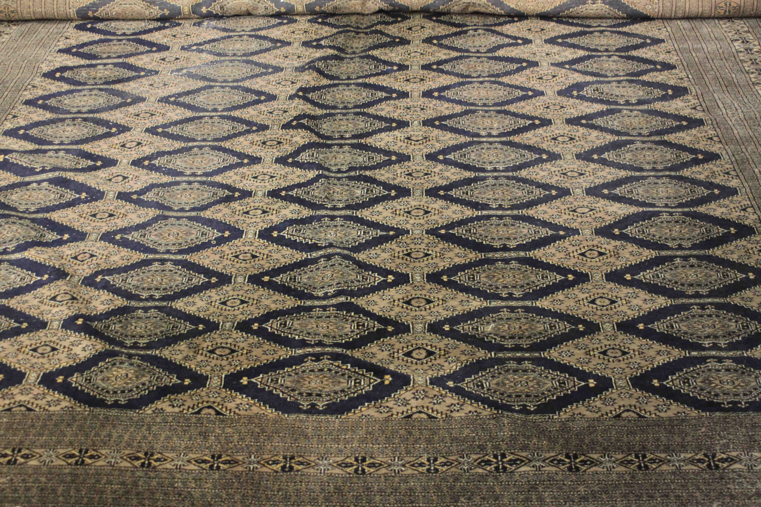 A hand made blue ground Bokhara carpet. L.460 W.310cm. - Image 3 of 7