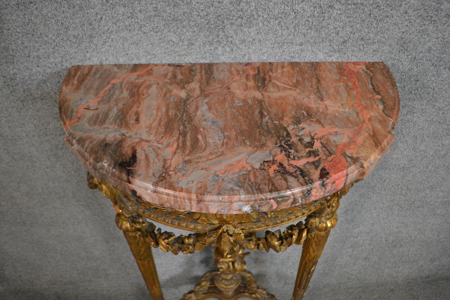 A carved gilt console table with demi lune pink marble top above fluted tapering supports and all - Image 4 of 7