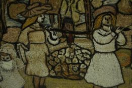 A framed early 20th century Irish needlepoint embroidery of a couple carrying a sack on a pole