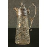 A silver plated and cut crystal 19th century claret jug. The lid with a lion finial and figural