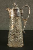 A silver plated and cut crystal 19th century claret jug. The lid with a lion finial and figural