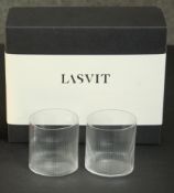 A boxed set of Lasvit 'Circle glass' tumblers with certificate. H.12 W.23 D.18cm (Largest)