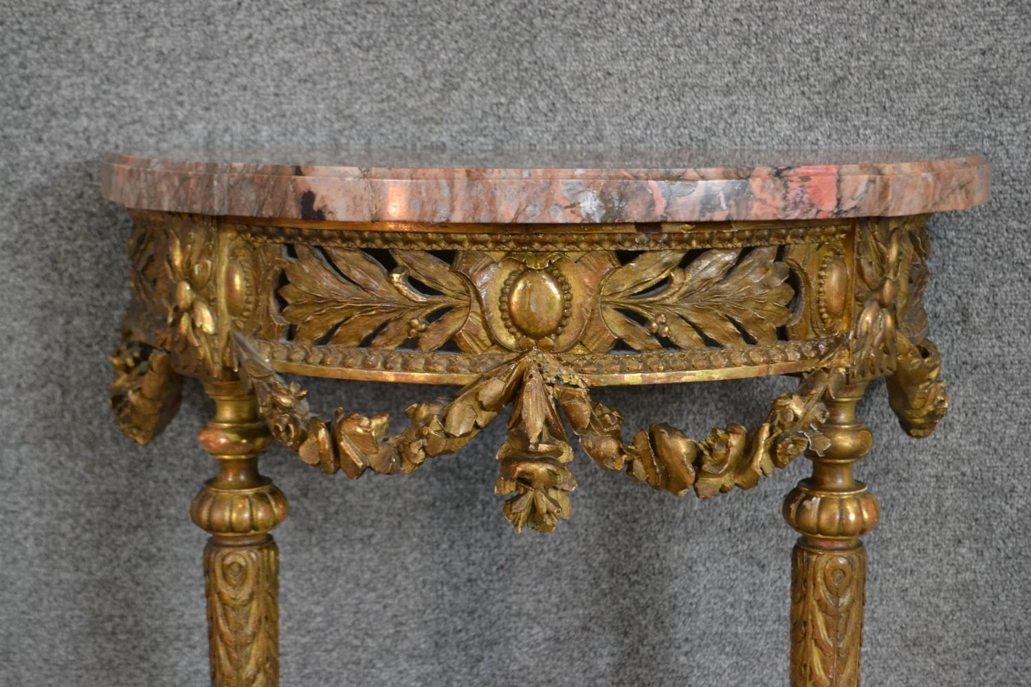 A carved gilt console table with demi lune pink marble top above fluted tapering supports and all - Image 2 of 7