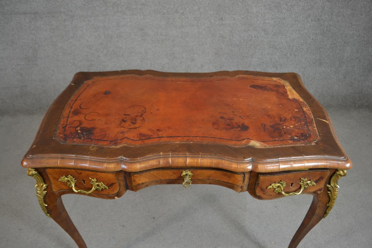 A Louis XV style bureau plat, with a tooled brown leather writing surface, over three short drawers, - Image 6 of 10