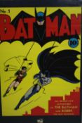 A framed and glazed vintage style Batman poster on board. H.100 W.71cm.