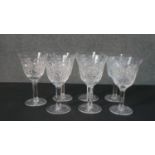 A set of seven hand cut sherry glasses with a star cut bases. H.17 Diam.10cm