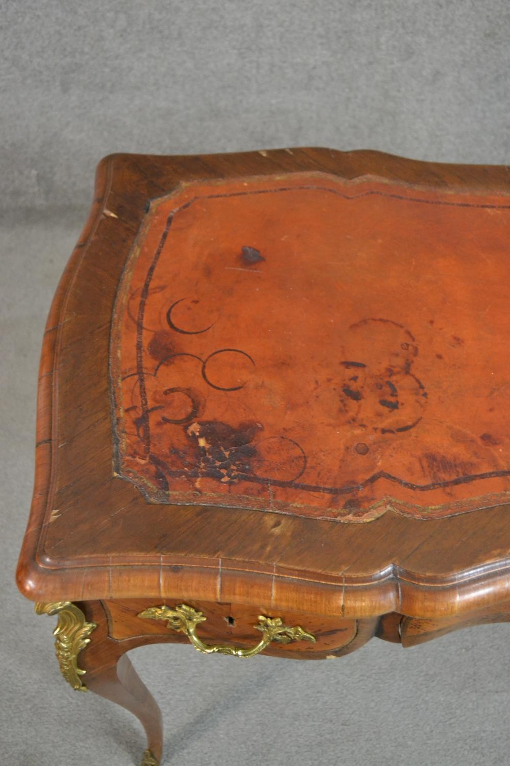 A Louis XV style bureau plat, with a tooled brown leather writing surface, over three short drawers, - Image 8 of 10