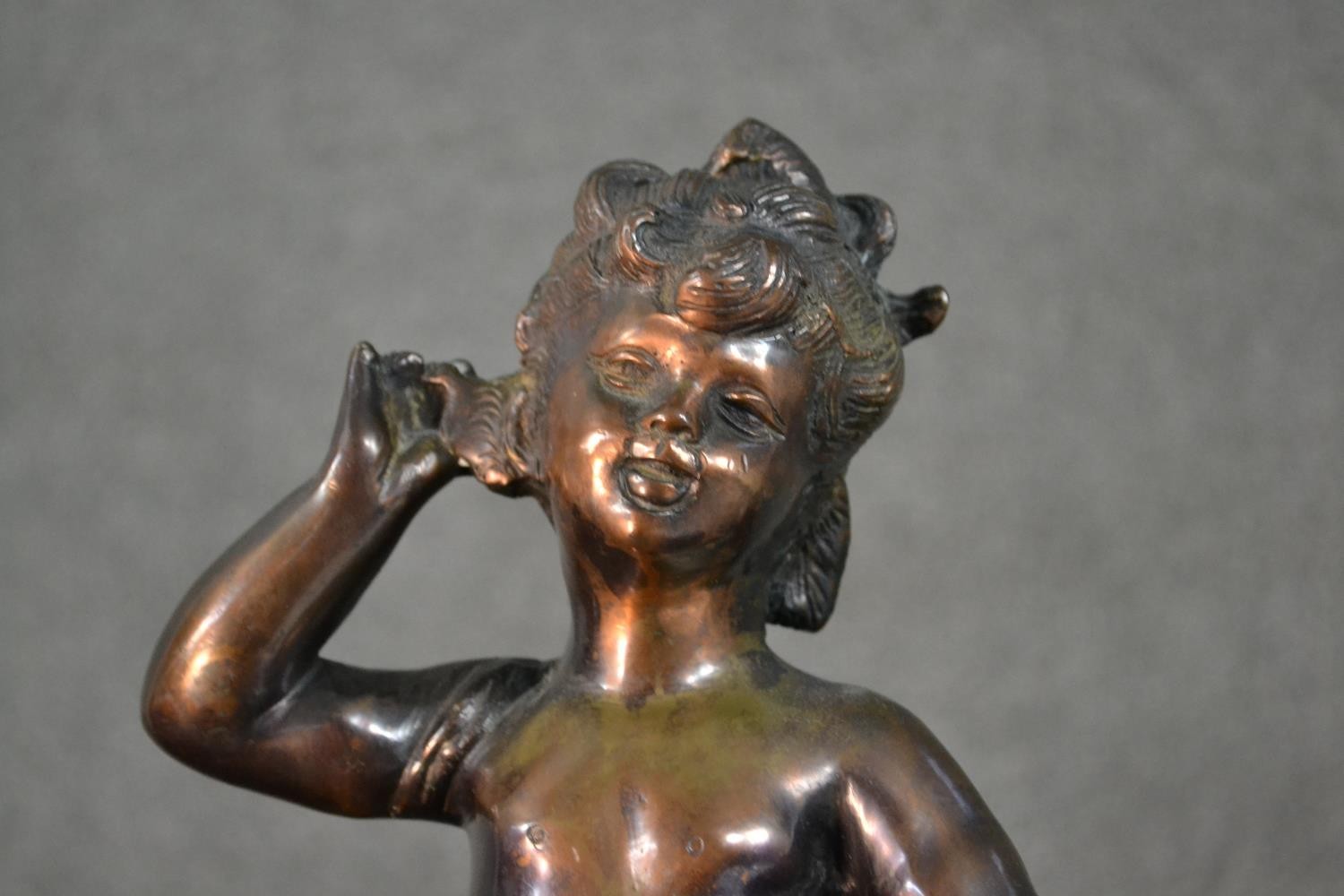 A spelter figure of a classical style putti with a basket of flowers. H.37cm - Image 3 of 8