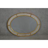 A 19th century Venetian style oval wall mirror with rope design border. H.81 W.60cm