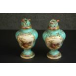 A pair of 18th century Chelsea style hand painted porcelain potpourri vases with turquoise ground,