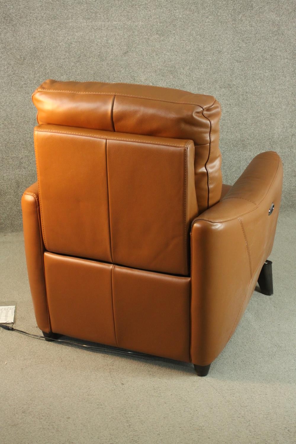 A contemporary tan leather electric reclining armchair, possibly Natuzzi, with instructions. In good - Image 7 of 10