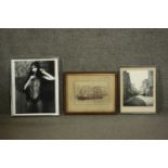 Three framed and glazed black and white photographs. One of an Art Deco dancer, one of a street