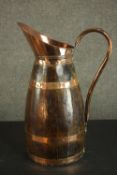 An early 20th century coopered coal hod (scuttle), with copper banding, handle and spout. H.61 W.