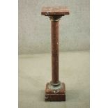 A late 19th century red marble torchère, with a square top, on a cylindrical column with cast gilt