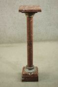 A late 19th century red marble torchère, with a square top, on a cylindrical column with cast gilt