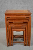 A quartetto nest of four Chinese hardwood tables, with rectangular tops, the legs joined by shaped