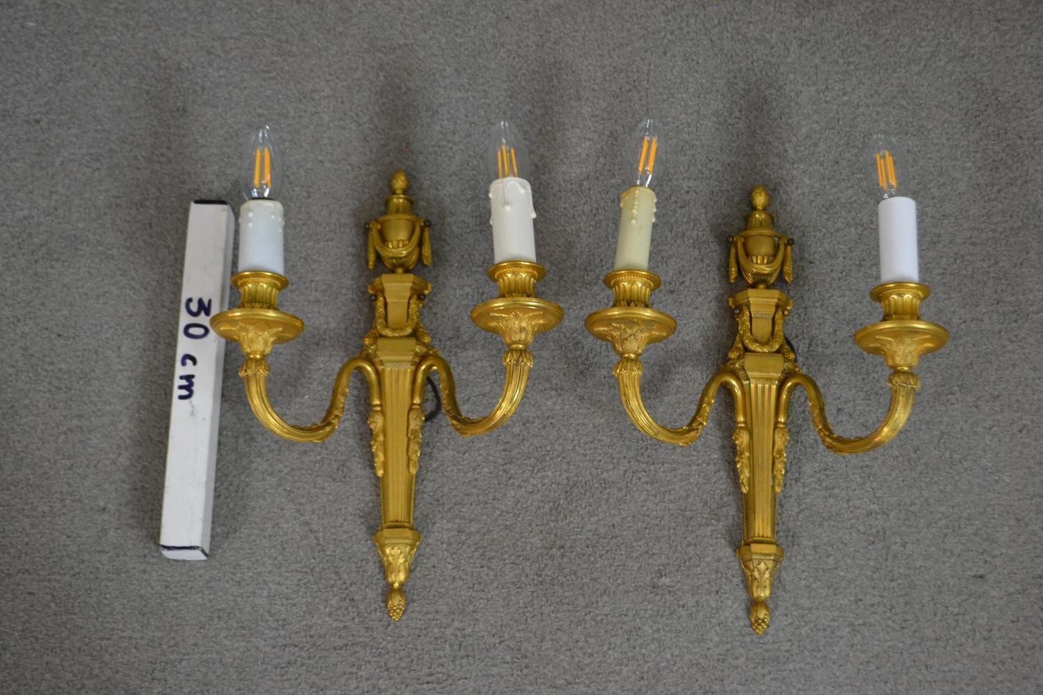 A pair of 19th century gilt metal two branch wall sconces with swag and foliate design. H.39 W.49cm - Image 2 of 6