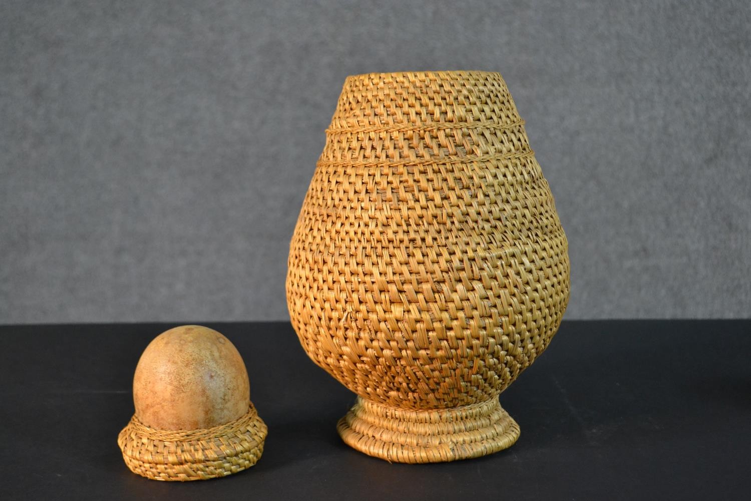 A woven African tribal vessel along with a smaller woven lidded pot. H.33cm (largest) - Image 4 of 6