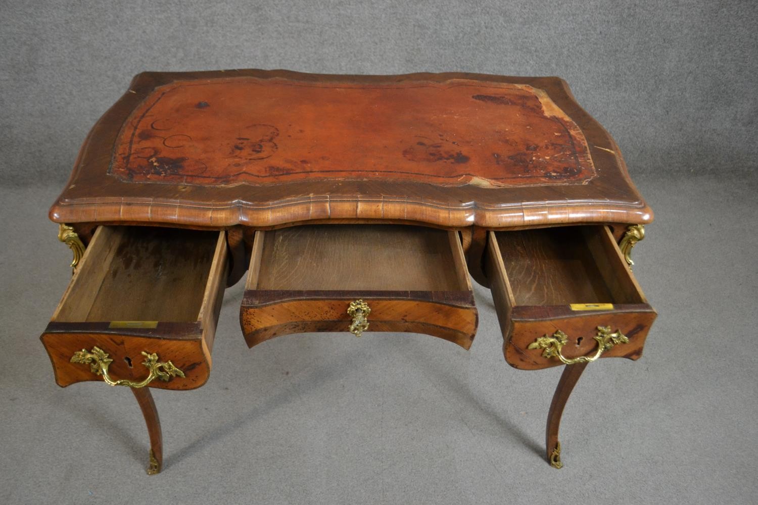 A Louis XV style bureau plat, with a tooled brown leather writing surface, over three short drawers, - Image 3 of 10