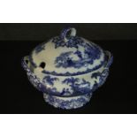 A Doulton Watteau pattern blue and white china tureen, the lid with a loop handle, the body with two