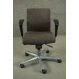 HAG, Norway, a contemporary swivel office chair, upholstered in striped black fabric, on a five