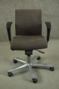 HAG, Norway, a contemporary swivel office chair, upholstered in striped black fabric, on a five