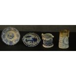 A collection of 19th century blue and white transferware, including two commemorative jugs, makers