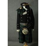 An adult male full Scottish Highland traditional dress outfit. It includes: jacket, kilt, waistcoat,