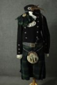 An adult male full Scottish Highland traditional dress outfit. It includes: jacket, kilt, waistcoat,