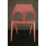 Carl Jacobs for Kandya, a Jason Chair, plywood, on tapering cylindrical legs, later painted pink.