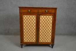 A 19th century mahogany side cabinet two drawers over two cupboard doors with cross banding. H.89