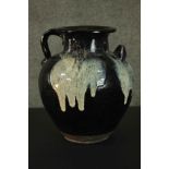 An early Chinese black ware handled ceramic ewer with white splashes. H.31cm.