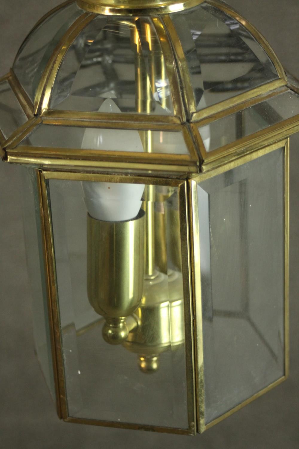 A pair of reproduction George III style brass hall lanterns, of hexagonal section, each with two - Image 4 of 8