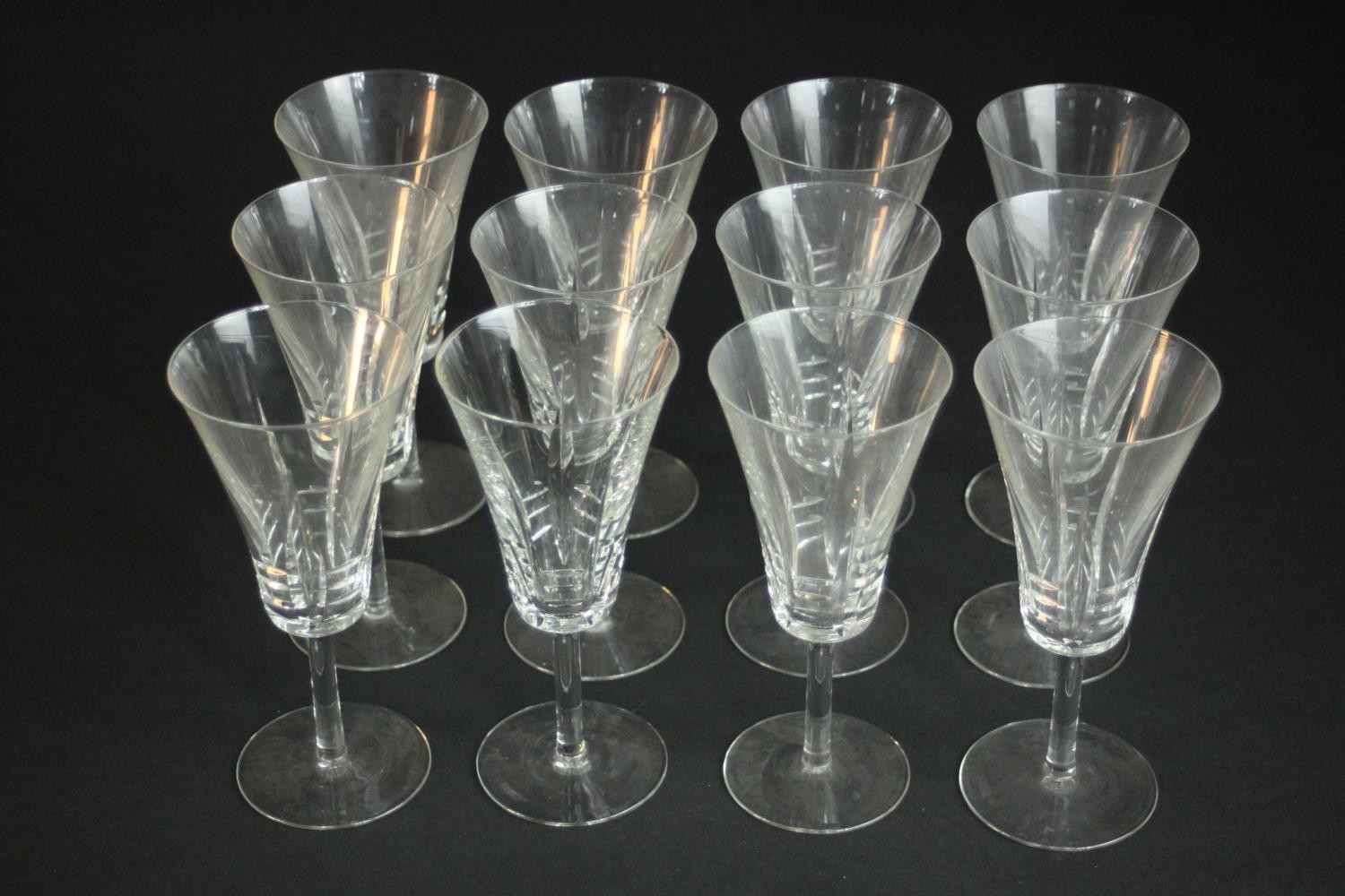 A set of twelve hand cut crystal wine glasses with trumpet shape. H.17 Dia. 8cm.