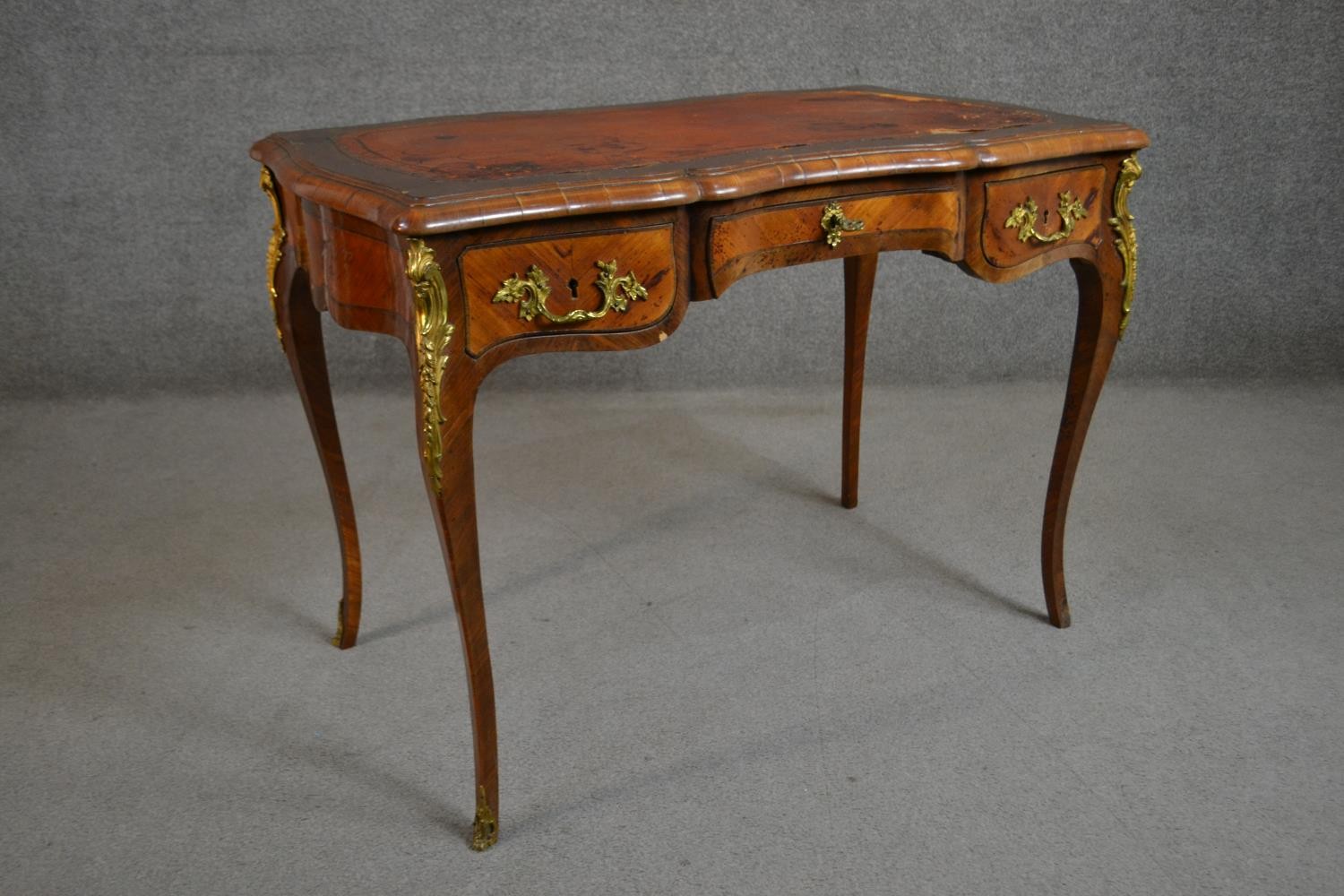 A Louis XV style bureau plat, with a tooled brown leather writing surface, over three short drawers, - Image 9 of 10