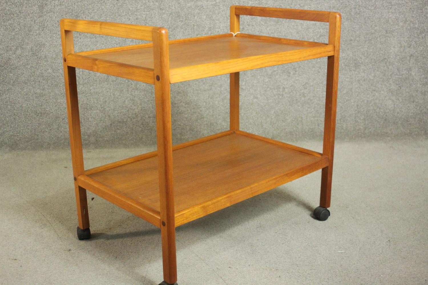 A circa 1970s Danish teak tea trolley, with two tiers, stamped 'Made in Denmark' to the underside. - Image 2 of 8