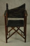 A 20th century 'Firma' folding campaign chair, upholstered in black fabric (damaged), made at the