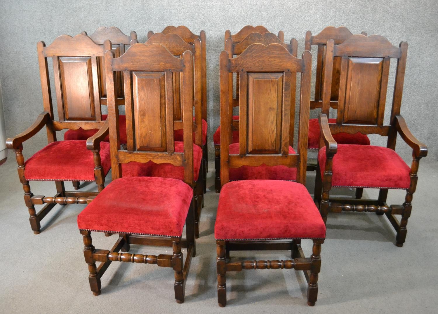 A set of ten early 20th century country antique style oak high back dining chairs, including two