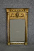 A 19th century gilt wood pier mirror with relief foliate and star moulding. H.66 W.41cm