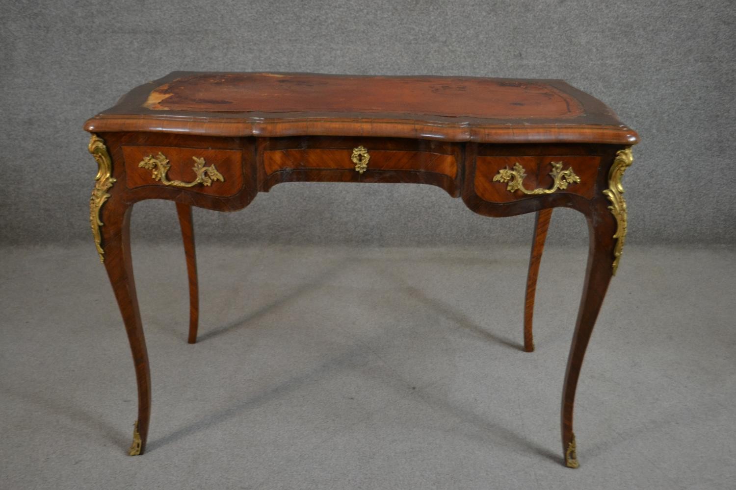 A Louis XV style bureau plat, with a tooled brown leather writing surface, over three short drawers, - Image 10 of 10