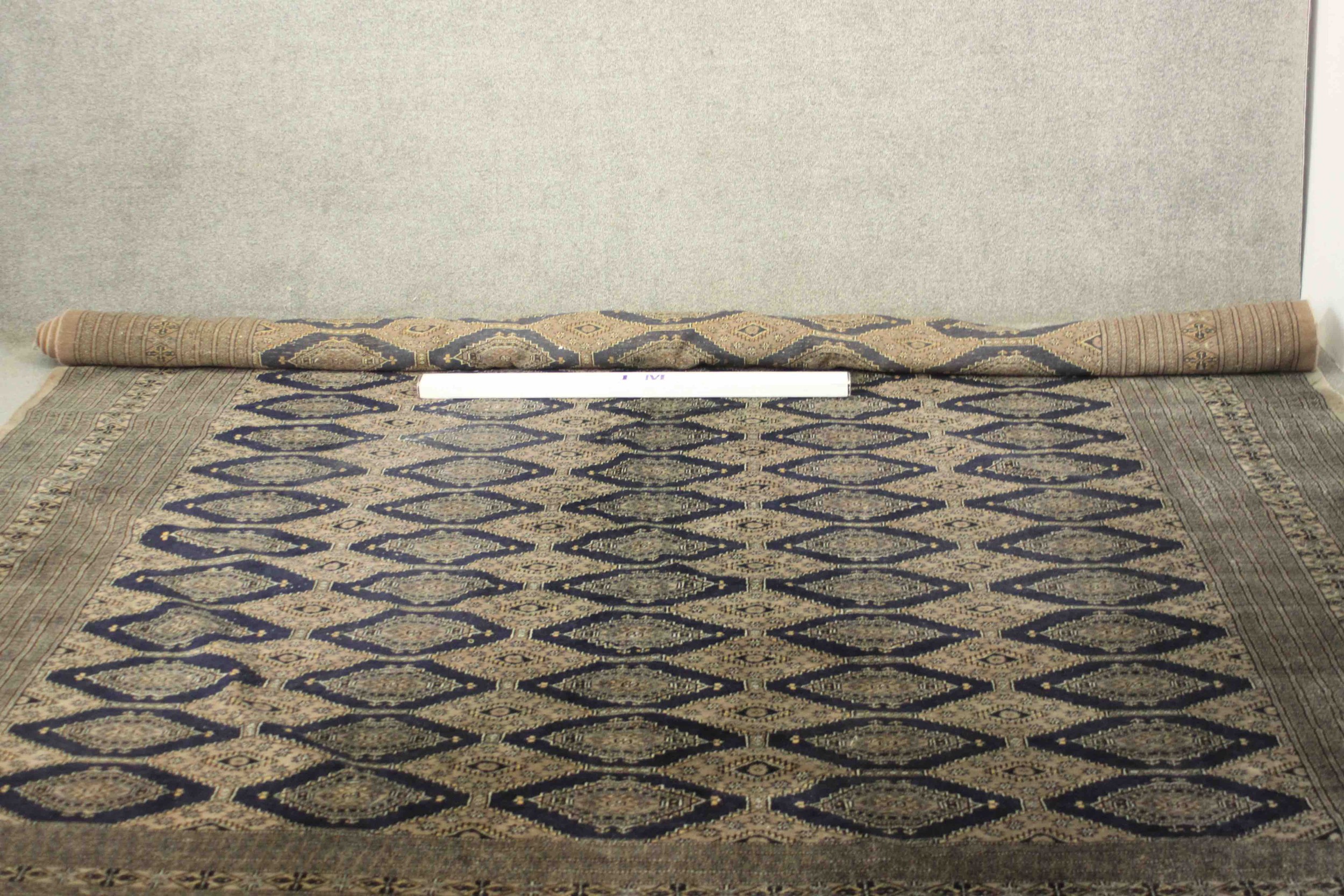 A hand made blue ground Bokhara carpet. L.460 W.310cm. - Image 2 of 7
