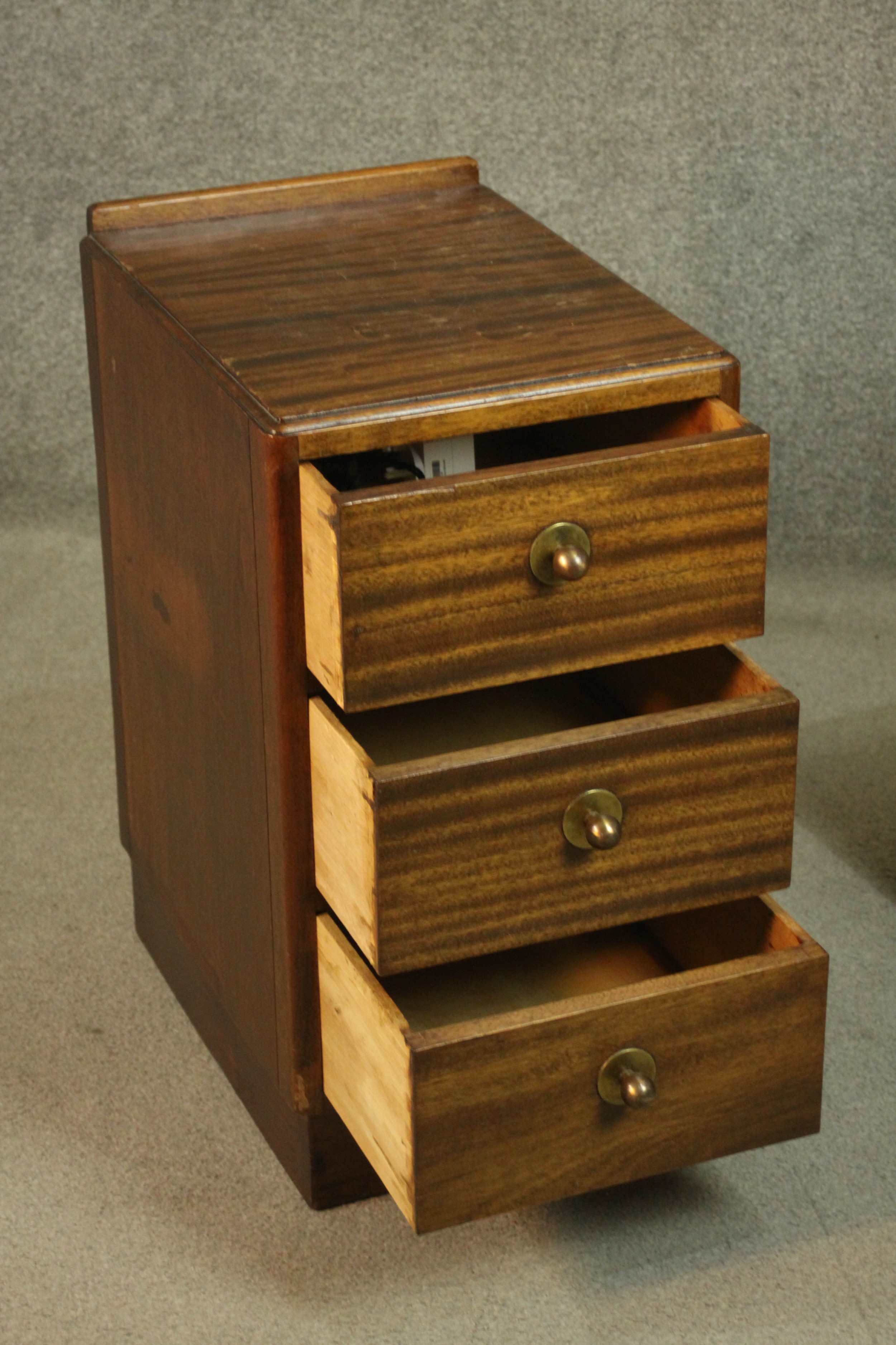 A pair of mid 20th century bedside chests, with a gallery back over three long drawers, on a - Image 4 of 6