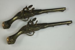 A pair of brass decorative duelling pistols. L.43 (each)