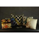 A collection of six contemporary cushions.