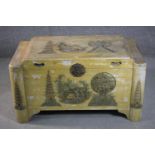A 20th century Chinese yellow painted camphorwood trunk, decorated to the top and front wth a pagoda