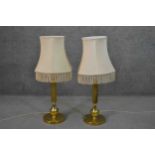 A pair of vintage brass fluted column design table lamps with cream silk shades. H.85cm