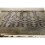 A hand made blue ground Bokhara carpet. L.460 W.310cm.